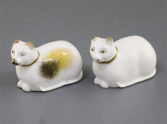 Two Rockingham porcelain figures of a recumbent cat, c.1830, L. 6.7cm and 7cm, chips to ears